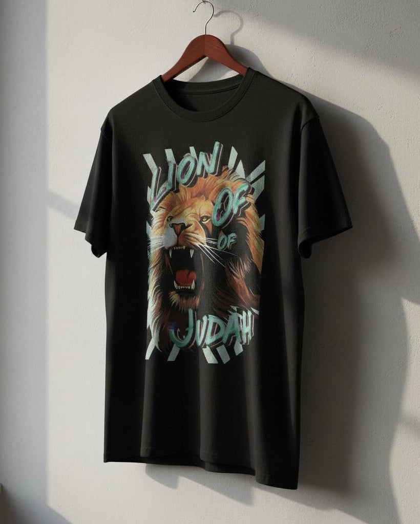Black t-shirt with a lion graphic and 'Lion of Judah' text on a hanger against a white wall.