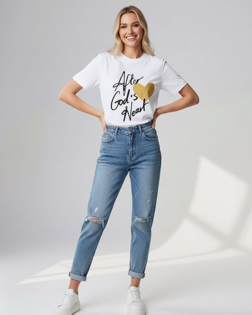 Woman wearing a white t-shirt with text and blue jeans on a light gray background