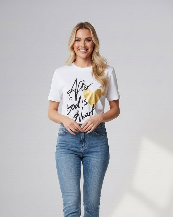 Woman wearing a white t-shirt with text and graphics, blue jeans, and white sneakers on a light gray background