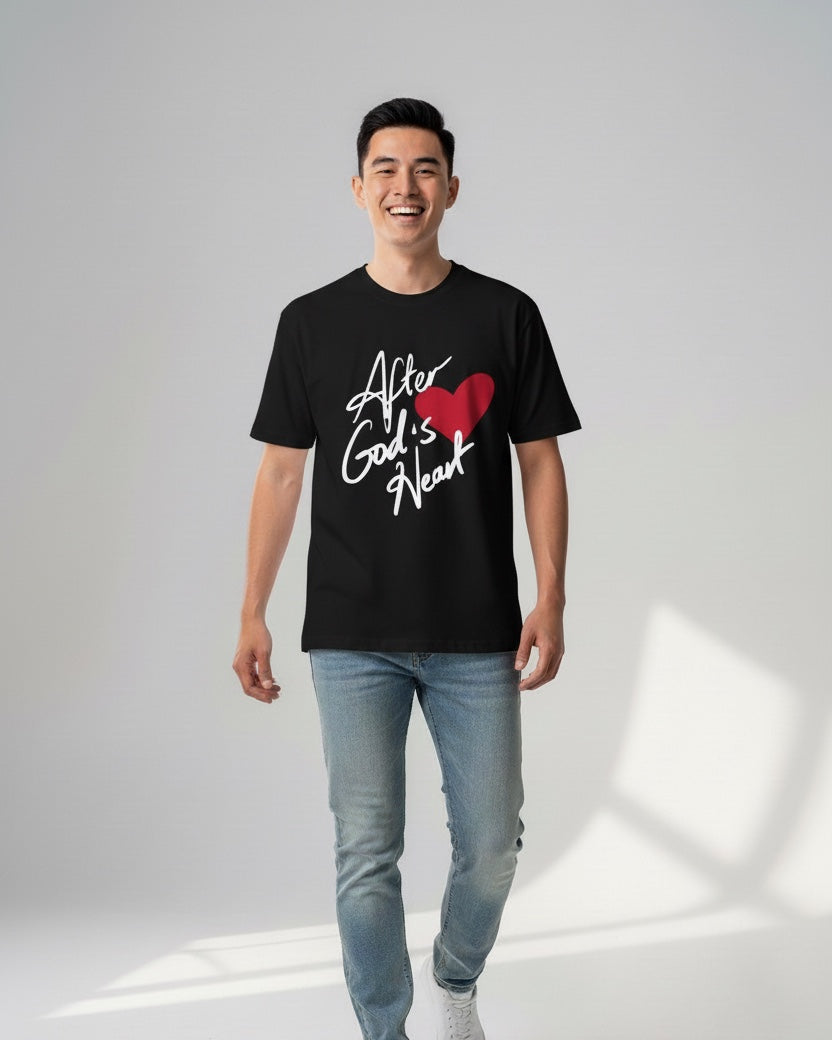 Man wearing a black t-shirt with a graphic design on a white background
