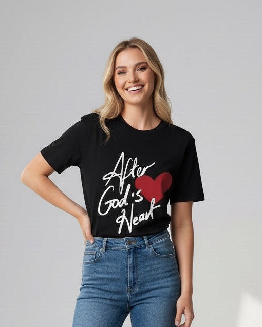 Woman wearing a black t-shirt with text and blue jeans on a white background