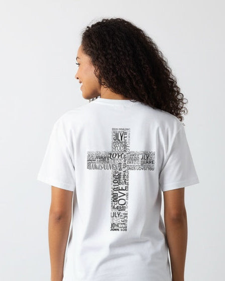 Person wearing a white t-shirt with a cross design on the back, standing against a plain white wall.