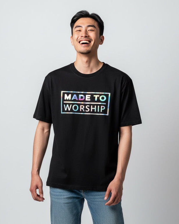 Man wearing a black t-shirt with 'Made to Worship' text on a white background