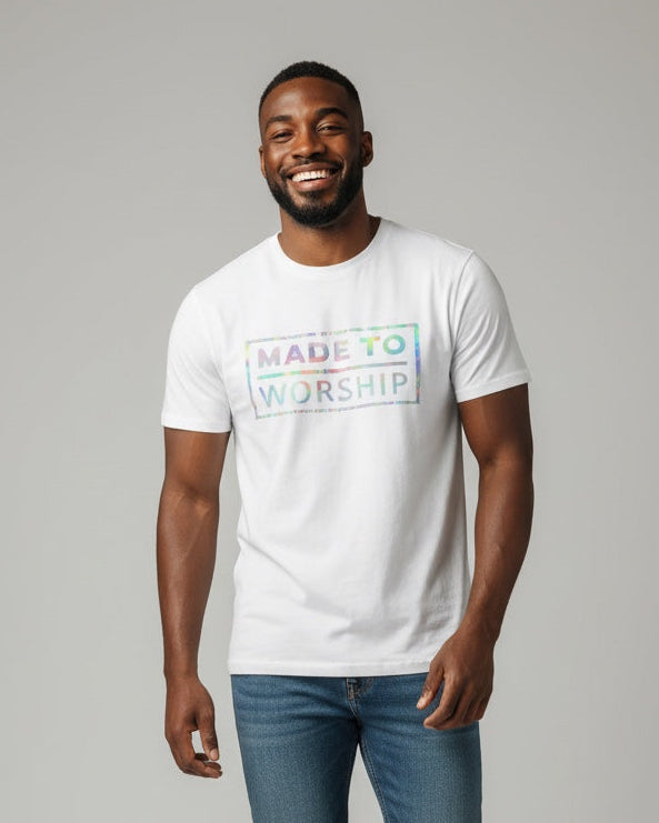 Man wearing a white t-shirt with text and blue jeans on a gray background